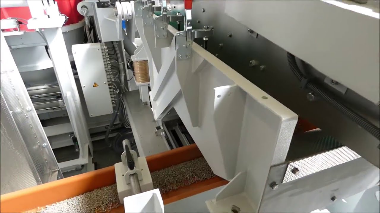 Sistem debavurare/lustruire/curatare piese , total automat cu sistem de separare magnetic .