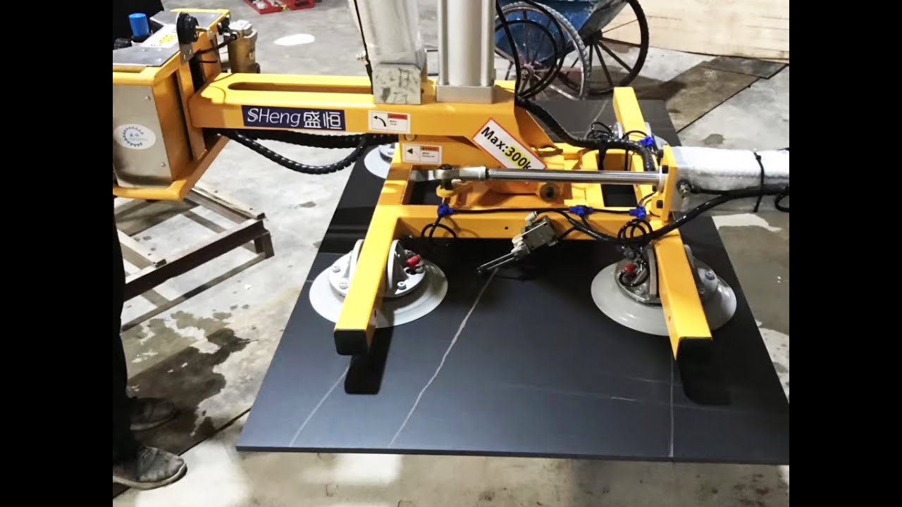 Stone lifter for handling slabs and tiles in water jet cutting