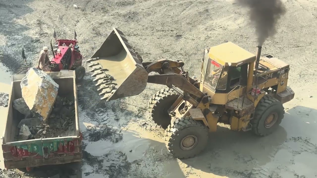 Caterpillar 966 Loading Dump Truck with Massive PowerHeavy Duty Action – CAT 966 Filling a DumpTruck