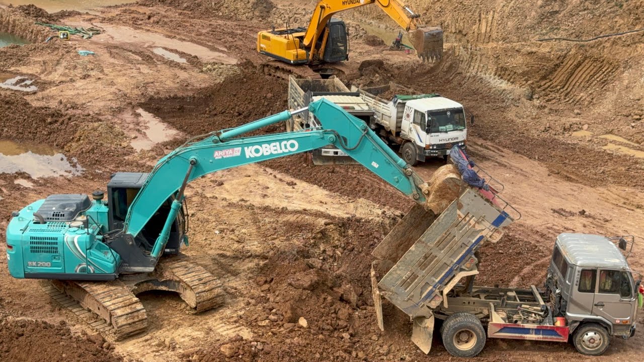 16: Powerhouse Pairing: KOBELCO SK200 Excavator and Dump Trucks Elevate Construction Productivity!