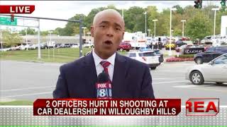 2 officers injured in car dealership shooting