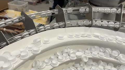 Bowl Feeder feeds and orientates Plastic Cover Caps | RNA Automation Ltd