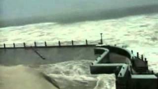 Amateur camcorder footage of the 2004 tsunami disaster. captures
sudden crashing a giant wave against vivekananda rock memorial,
situa...