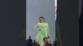 stan twitter: rosalía posing and chewing gum on stage while bizcochito plays in the background