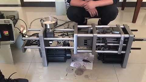 Desktop injection molding machine testing in the factory before delivery to guarantee it works well