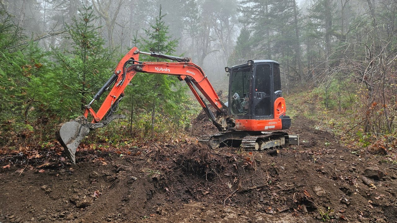 Off grid woodshed pad with the Kubota KX 040 4 excavator - YouTube