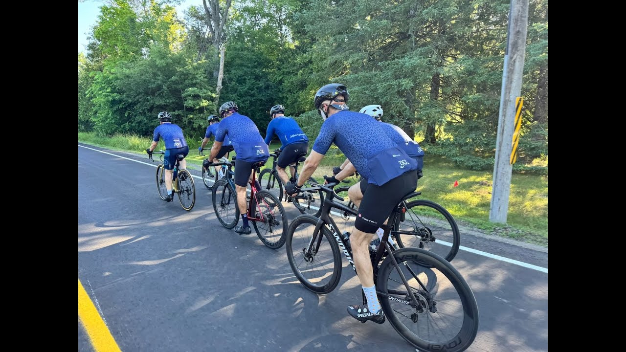 Jaffari Cycling Club members riding together on a country road