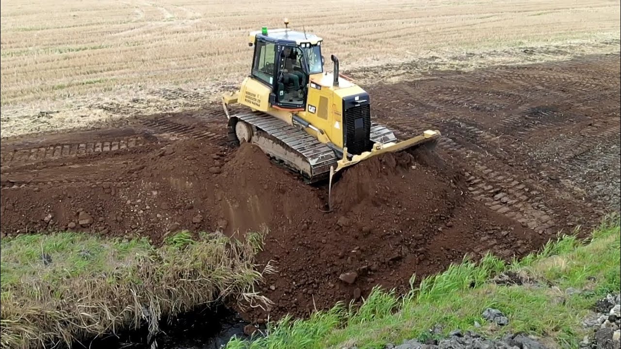 CAT D6K2 Dozer Filling in Ditch