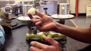 Odd Balance Challenge Balancing A Steel Ball And Pong Pong Ball Submerged In Water.