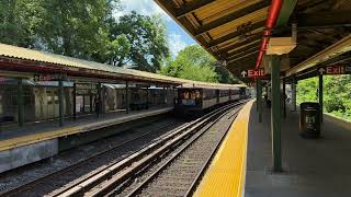 Manhattan bound R46 (Q) train at Sheepshead Bay, with a 1907 BU Gate Cars bypassing the station.