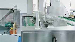 Continuous belt type vacuum packaging machine