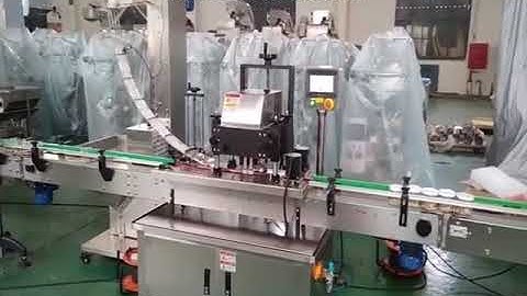 Automatic bottle cap positioning screw capping machine testing video