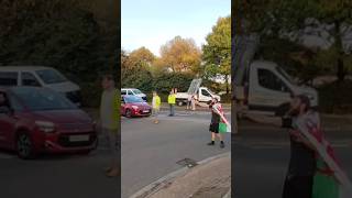 Welsh man directs traffic during protest | Road block traffic standstill. Rhoose, Wales.