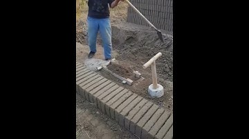 Handmade clay bricks making with a wooden tool