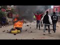 Protesters light bonfires during public transport strike in Kenya over fuel prices