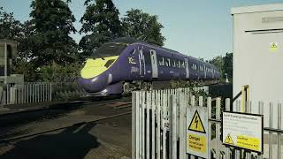 Class 395 passing Aylesford village Level crossing for St Pancras international 