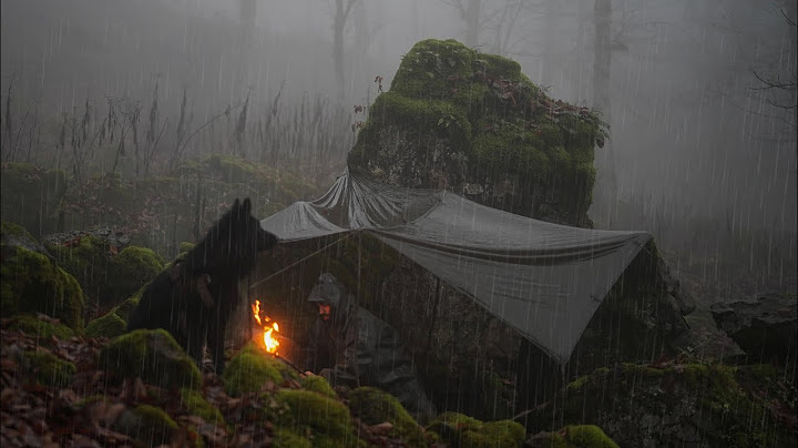 surviving rainstorm under a rock - No tent , No sleeping bag !