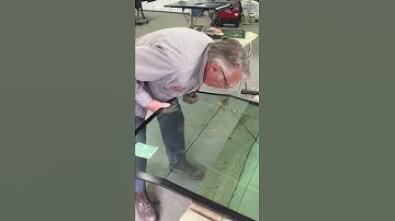 Cutting laminated curved glass