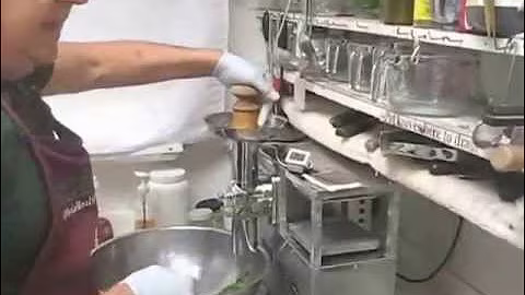Making juice with avocado pits on a Norwlk juicer