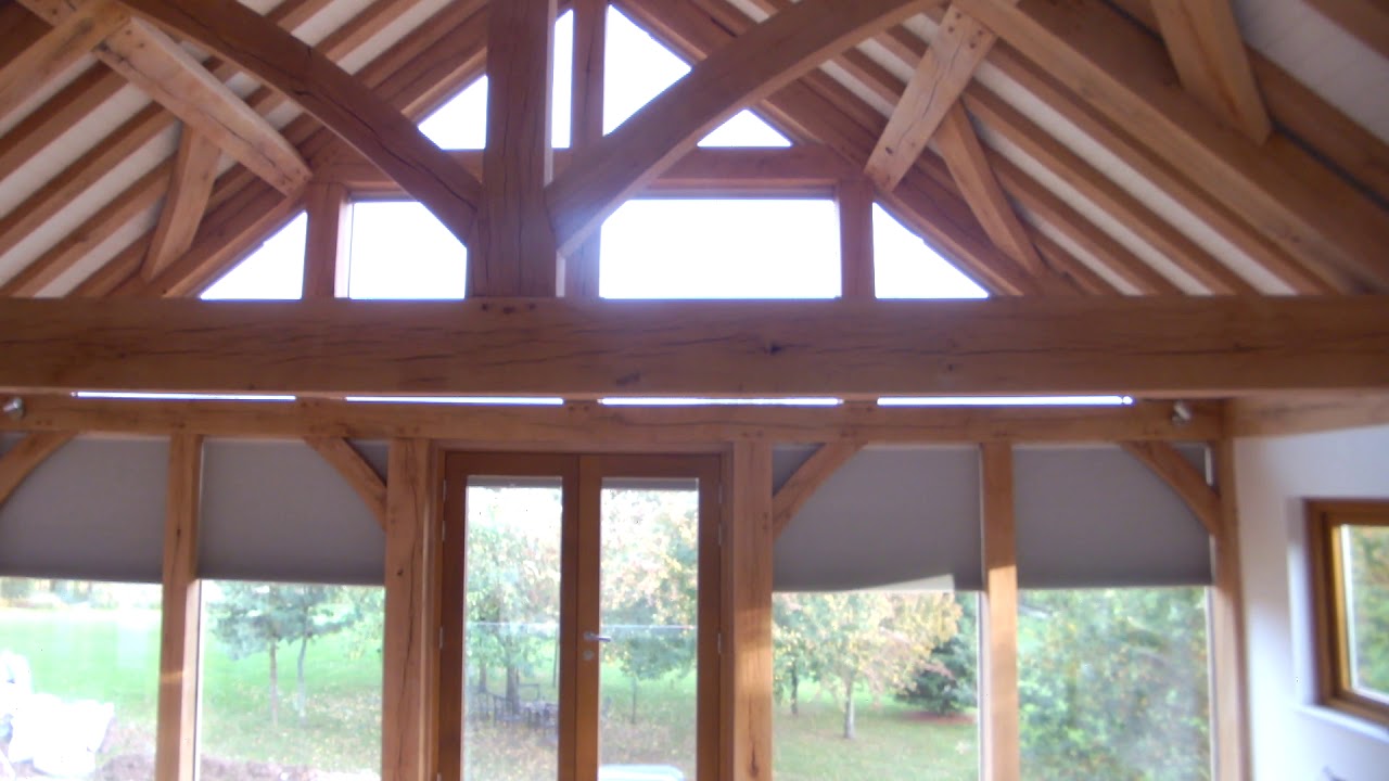 Electric Duette blinds in an oak-framed gable end window