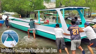 traditional wooden boat launch and test drive