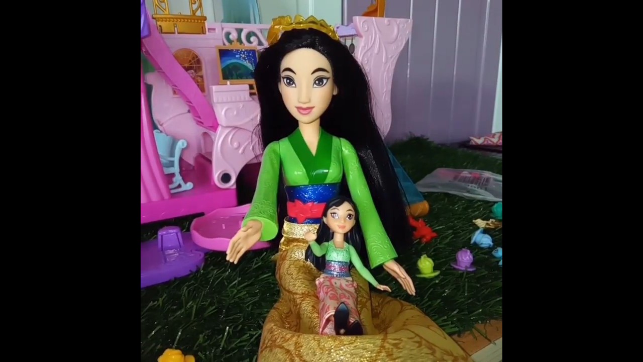 Mulan playing with her doll