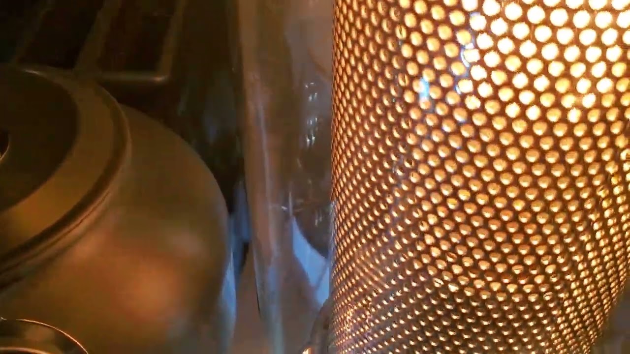 Using candle power and a light bulb to heat up area. Make tea at the same time with candle power.