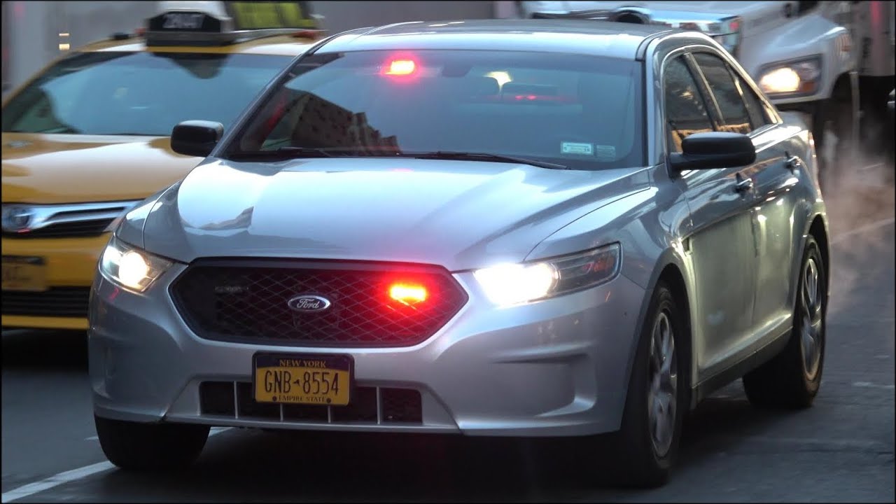NYPD Unmarked police car responding with siren and lights
