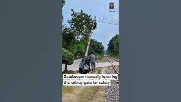 Gatekeeper manually lowering the railway gate for safety. #railway #train #railgate
