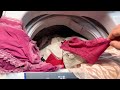 洗濯機の中にあるマイカの洗っていない服とランジェリー/Maika’s unwashed clothes and lingerie in the washing machine.