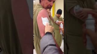 Makeup department applying tattoos.