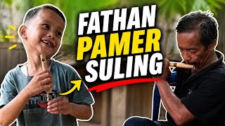 Fathan shows off his flute to Grandpa Harahap😄