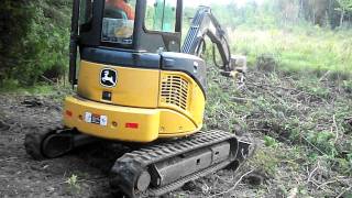 operating a John Deere 35D excavator