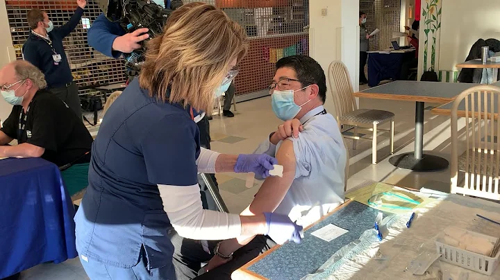 Dr David Tam Receives COVID-19 Vaccination