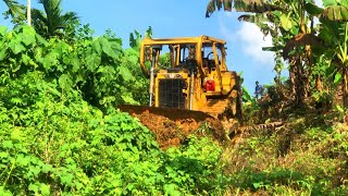 The D6R XL Bulldozer Operator Must Remove All Bushes To Make The Road Beautiful And Safe For Travel