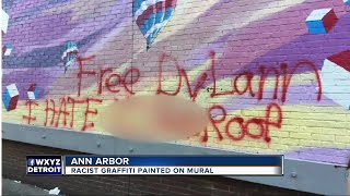 Racist graffiti painted on mural in Ann Arbor