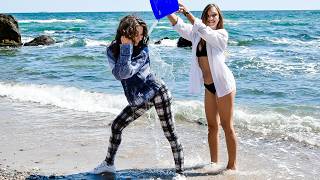 Wetlook A Girlfriend Helps A Beauty To Wet Her Clothes In An Interesting Way By Pouring It Over Her
