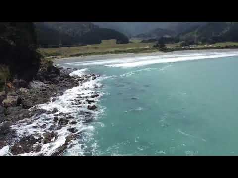 A flight over Robin Hood Bay and its sea arch., Robin Hood Bay surf spot, Marlborough / Nelson, New Zealand.