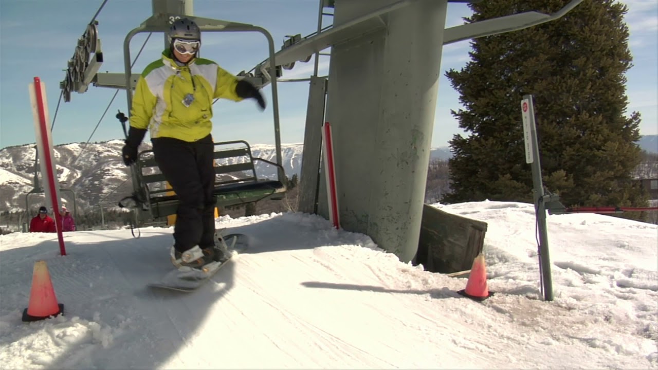 snowboarder and small child get off chairlift YouTube
