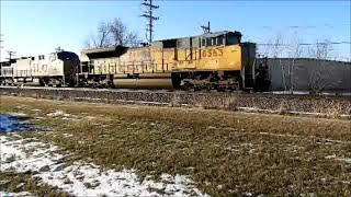 UP 8563 a SD70ACe leads a Z train with a horn salute east through Geneva IL