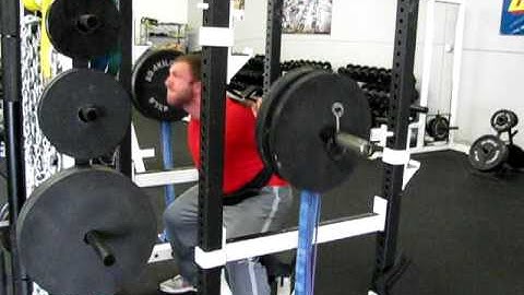 Juggernaut Training Systems-Chad Smith squatting with bands
