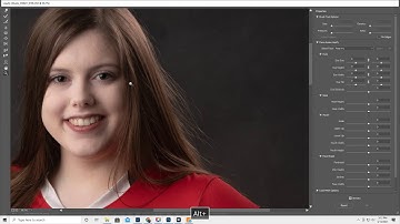 Liquify Hair flyaways in Photoshop and have it look natural. Freeze and Thaw tools in Liquify
