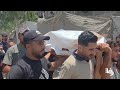 تشييع شهيدين ارتقيا بقصف إسرائيلي استهدف خيمة نازحين في مواصي خان يونس جنوب قطاع غزة