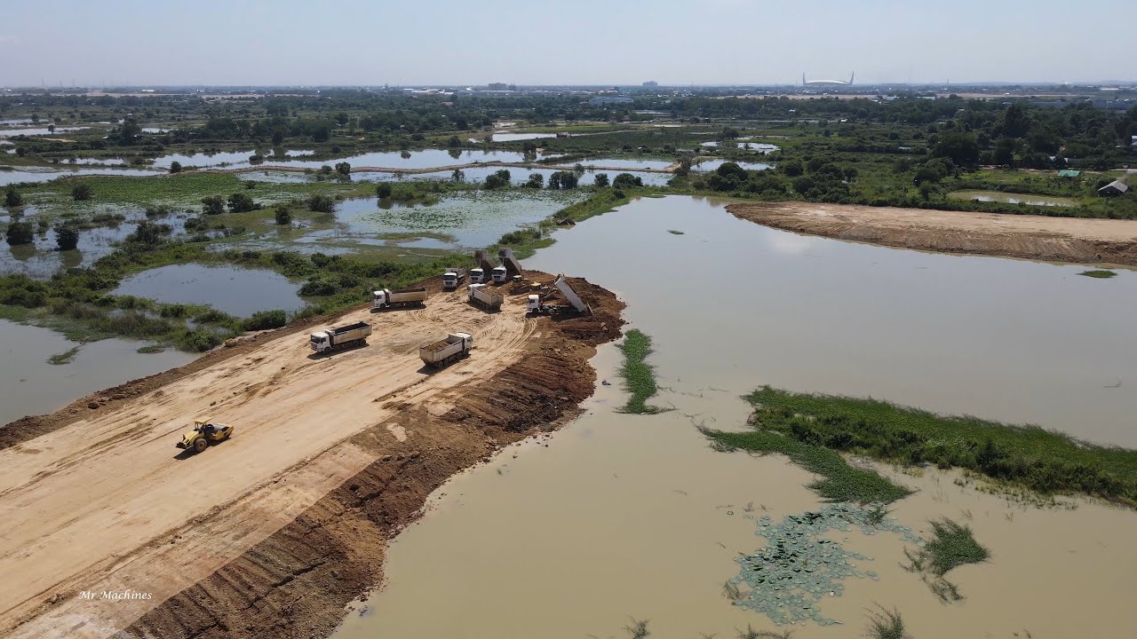 Great Mighty machinery in land reclamation construction bulldozer and truck