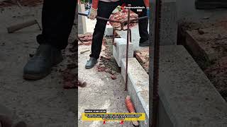 Worker Uses A Practical Manual Clamp Tool To Lift Heavy Concrete Blocks