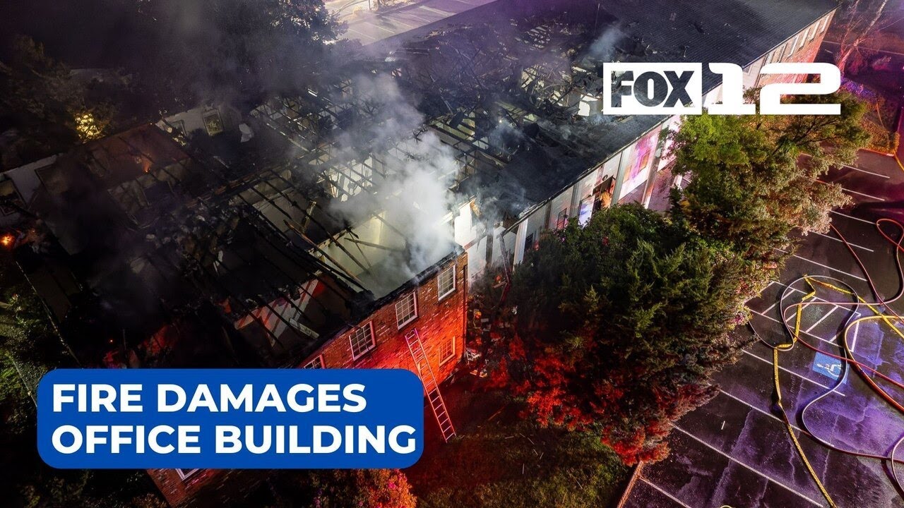 Two-alarm fire destroys roof of office building in SW Portland - YouTube