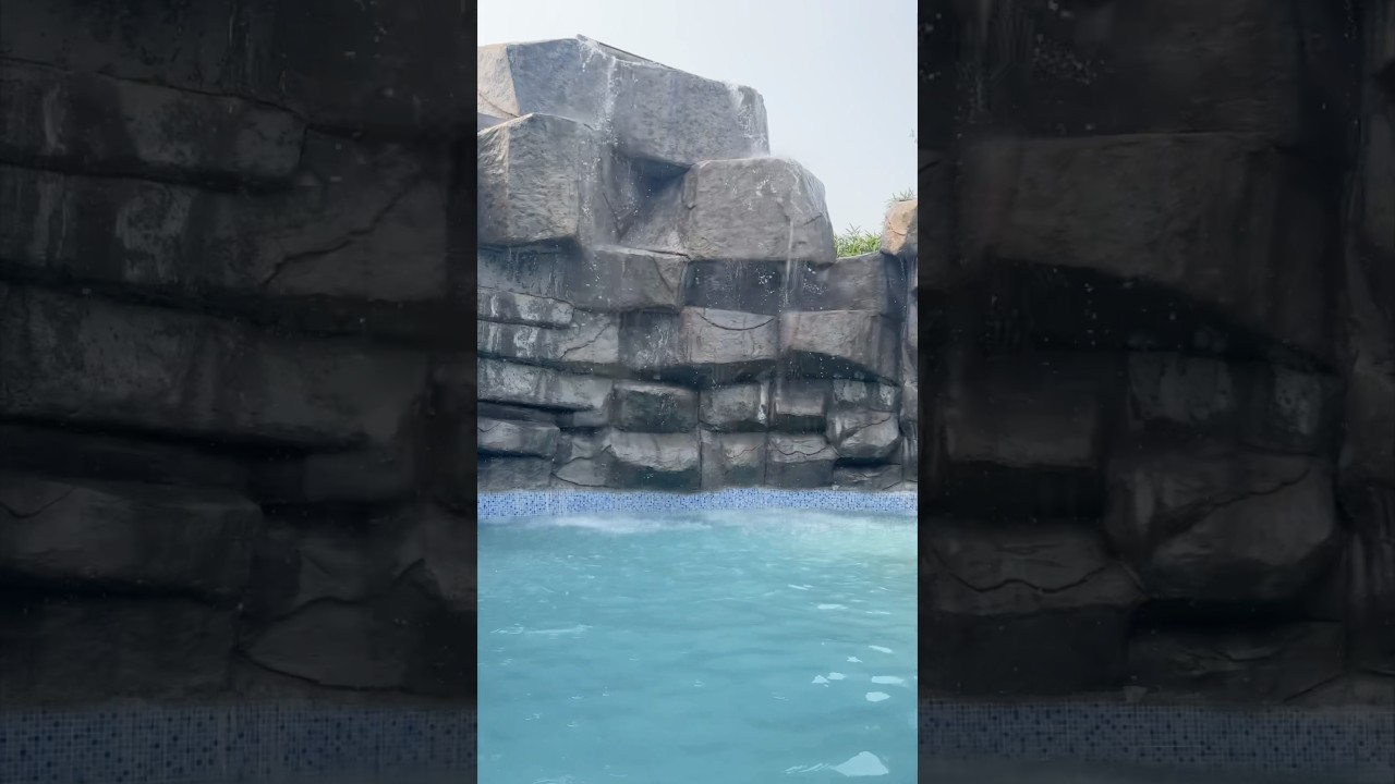 Hidden oasis found! 🏝️💦 A water park pool tucked between epic rocks! 
