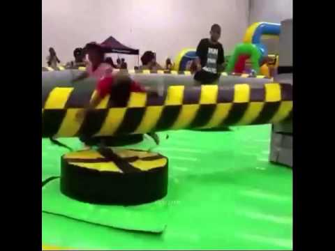 Kid gets hit by spinning thing