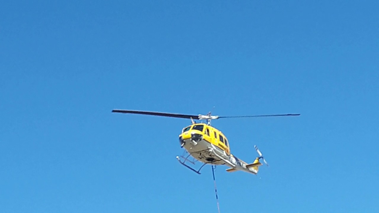 Helicopter firefighting working on fire huey