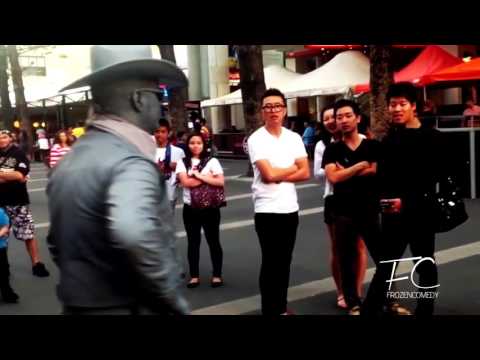 KruelAidMan gets punched by street performer for being a smart ass